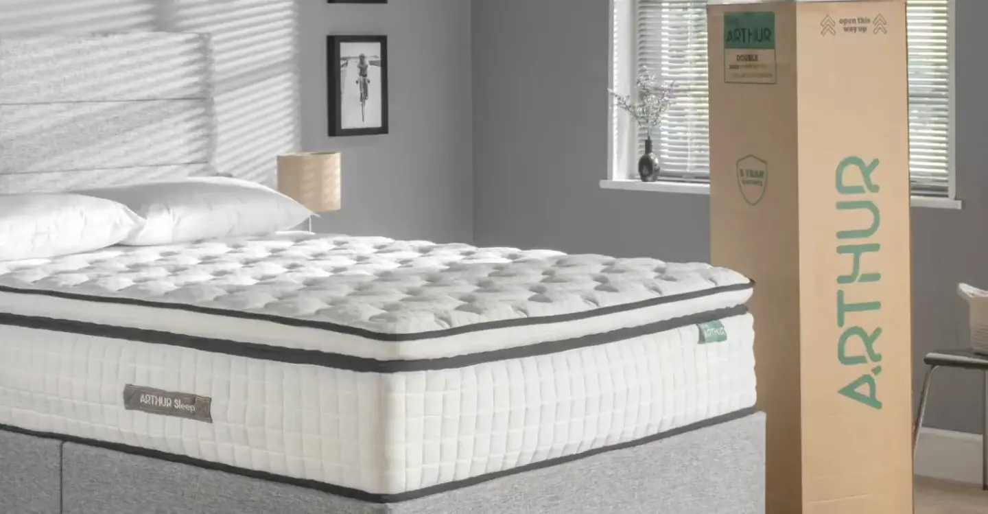 An Arthur Sleep mattress on a divan beside its delivery box, from Mattressman's own product film
