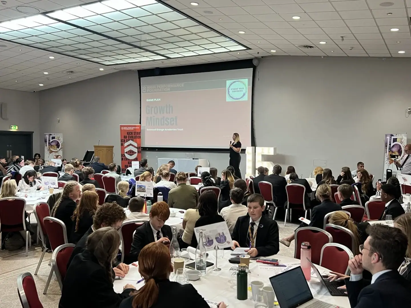 A hall full of young people at a High Performance Foundation event, from the Foundation's own photography