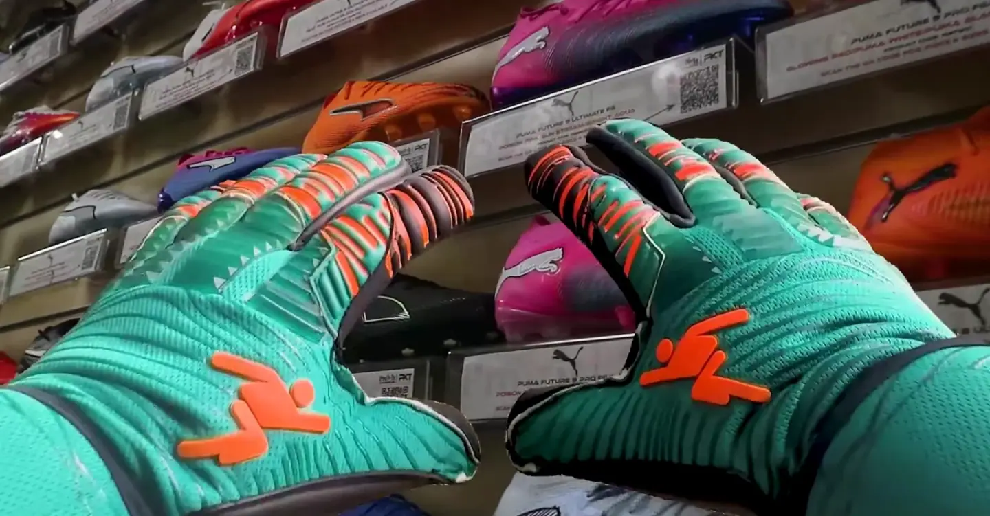 Trying on goalkeeper gloves in front of the boot wall at ProKit's store, from ProKit's own film